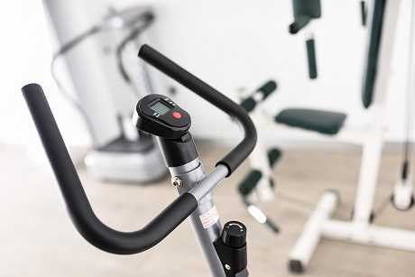 Picture of a bicycle in a gym. Rehab for elderly after hospiital stay.