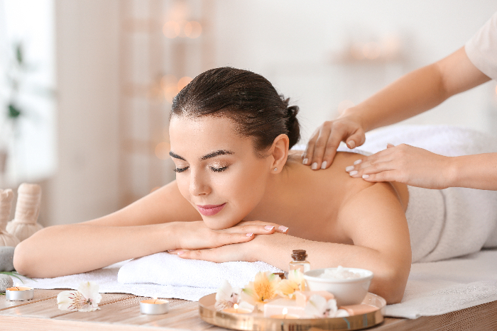 Caucasian woman receiving a back massage